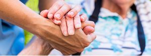 held hands while reviewing life insurance